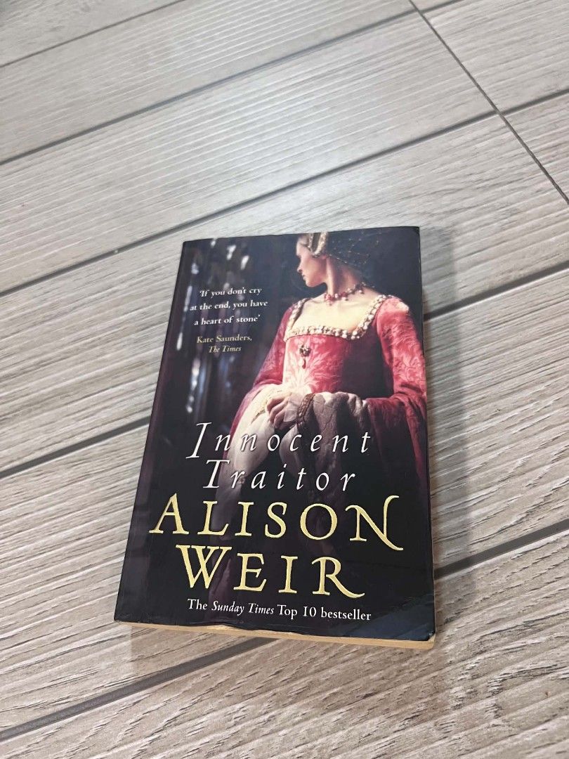 Innocent Traitor by Alison Weir Paperback Novel (Category: Storybooks) located in San Jose del Monte. Submitted by Skin_Care2022 (Listing ID 1468827685, Image 2). Description: - Title: Innocent Traitor by Alison Weir - Genre: Historical Fiction (Sunday Times Top 10 Bestseller) - Format: Paperback with standard size and striking black cover featuring a red dress portrait - Condition: Clean pages and spine, well-maintained - Perfect for: History fa
