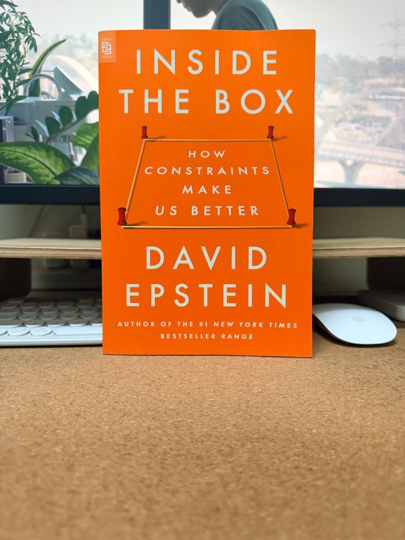 Inside the Box: How Constraints Make Us Better by David Epstein (Category: Storybooks) located in Taguig. Submitted by jmcuniverse1018 (Listing ID 1468852238, Image 1). Description: - Author: David Epstein - Format: Paperback with a striking orange cover - Condition: Great, read once, clean pages, and intact spine - Key Theme: Explores how constraints and broad interests improve performance and creativity - Perfect For: Nonfiction fans looking fo