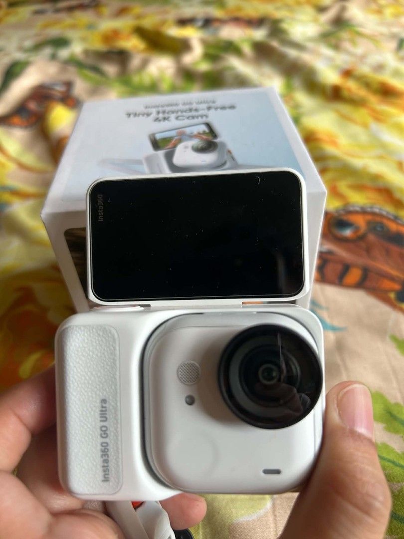 Insta360 GO Ultra Action Camera Set (Category: Video Cameras) located in Taguig. Submitted by lorrainebndct17 (Listing ID 1468788153, Image 2). Description: - 7months Old , Insta360 GO Ultra white action camera unit - Flip screen housing included - Original box packaging included - Charging cable, lanyard attachment, and magnetic mount base - Tiny hands-free 4K capture device - Ideal for vlogging and outdoor recording - Everything pictured is inc