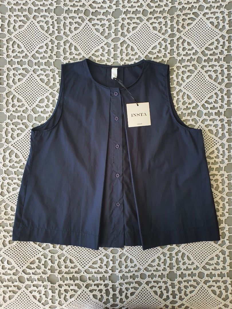 INSTA Firenze Navy Blue Sleeveless Button Top (Category: Sleeveless) located in Laoag. Submitted by soukay (Listing ID 1468719072, Image 1). Description: - Brand: INSTA Firenze from Italy - Color: Dark blue - Condition: Brand new with original paper tag attached, never worn - Style: Sleeveless top with round neckline, front button placket, matching round buttons, and pleated details - Size/Measurements: Roughly 21" across the chest and 22" in len