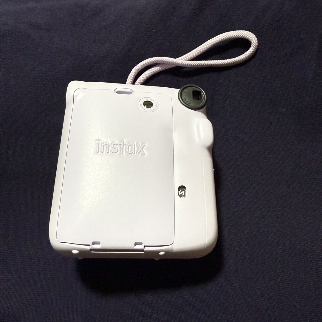 Instax Mini 12 (Category: Cameras) located in Quezon City. Submitted by jshoppppp (Listing ID 1468751577, Image 2). Description: Barely used. No issues. No more box. Selling the camera only Color: Light purple BPI, BDO, Gcash Delivery c/o buyer.