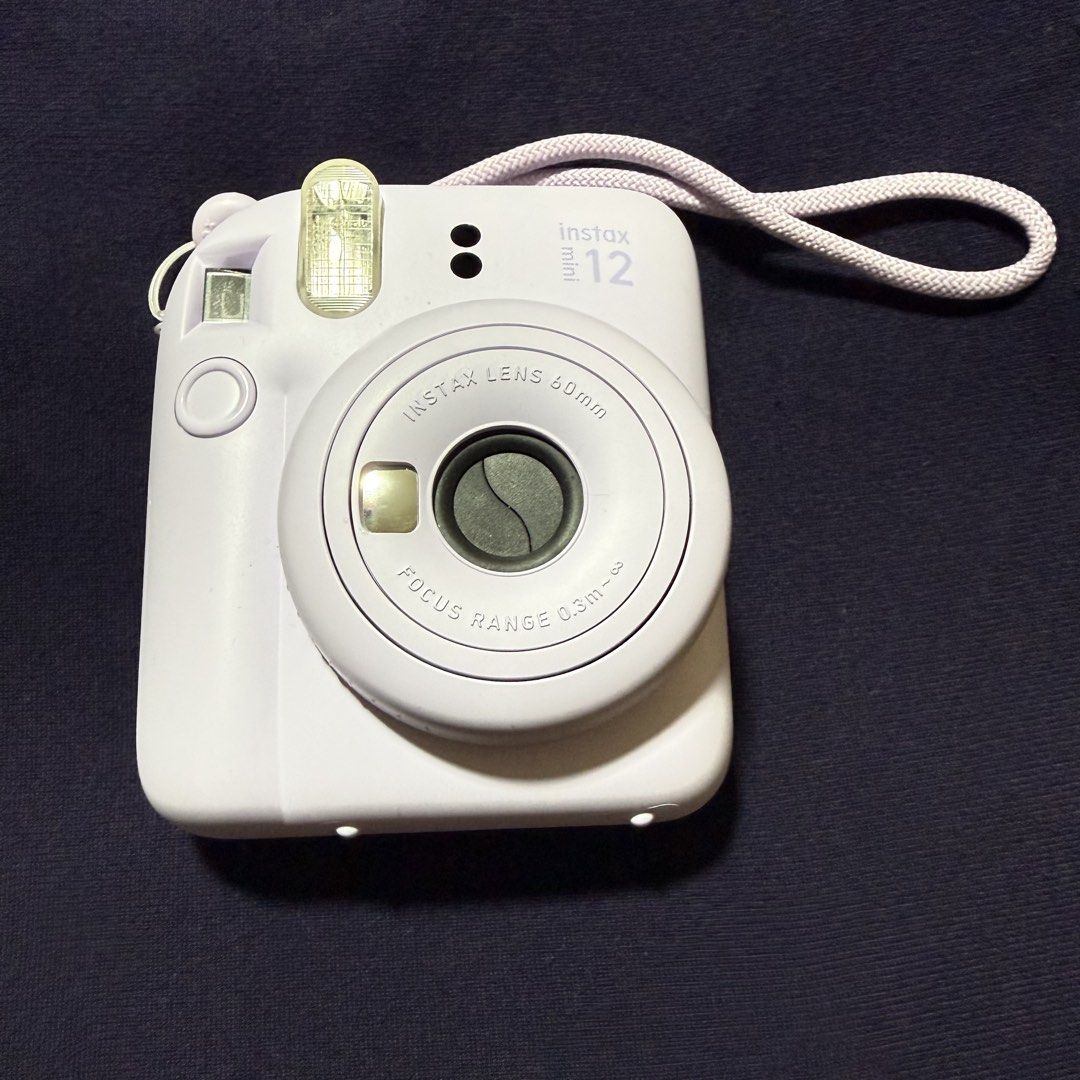 Instax Mini 12 (Category: Cameras) located in Quezon City. Submitted by jshoppppp (Listing ID 1468751577, Image 1). Description: Barely used. No issues. No more box. Selling the camera only Color: Light purple BPI, BDO, Gcash Delivery c/o buyer.