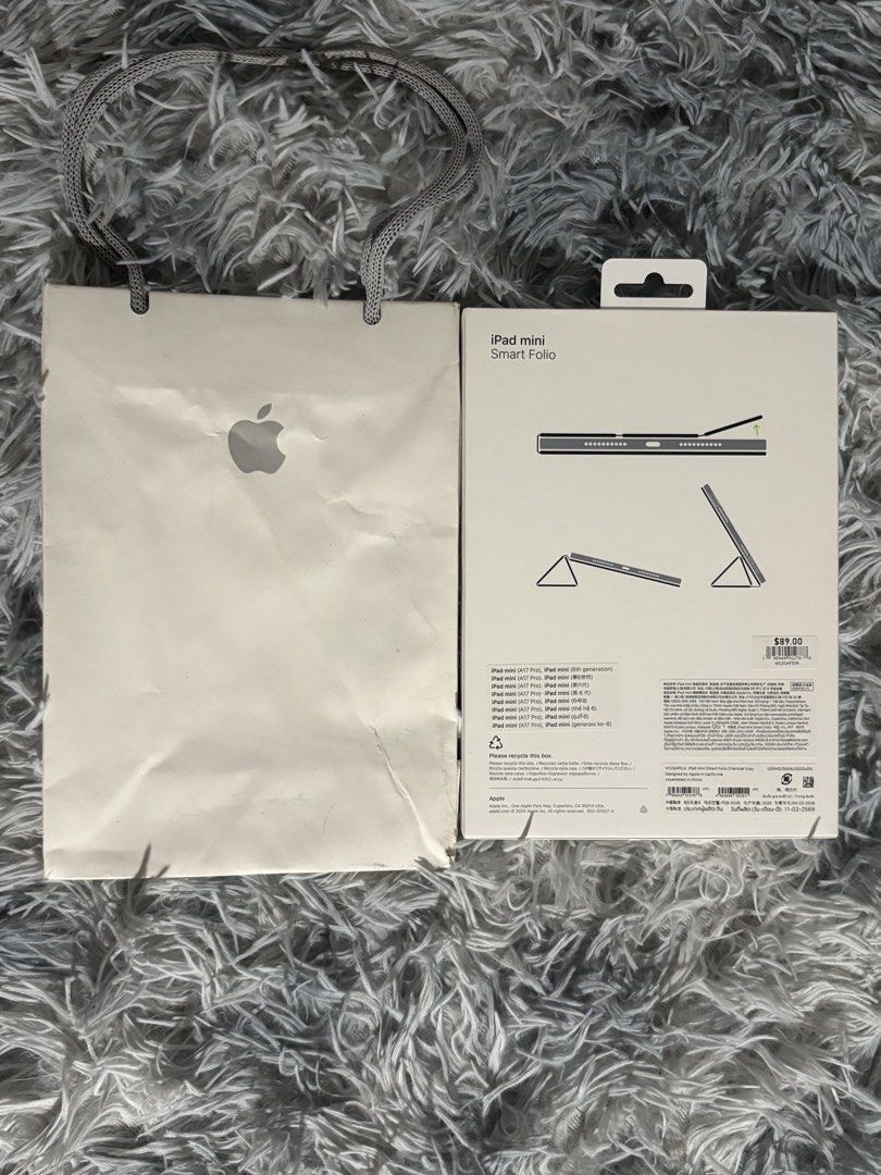 iPad mini Smart Folio Case (Charcoal Gray) - Authentic (Slightly Used) (Category: Cases & Sleeves) located in Manila. Submitted by engr.lee (Listing ID 1468863312, Image 2). Description: Selling a genuine Apple Smart Folio case for the iPad mini. Bought directly from Singapore for $89. It provides slim, lightweight protection for the front and back of your device. It automatically wakes your iPad when opened and puts it to sleep when closed. It e