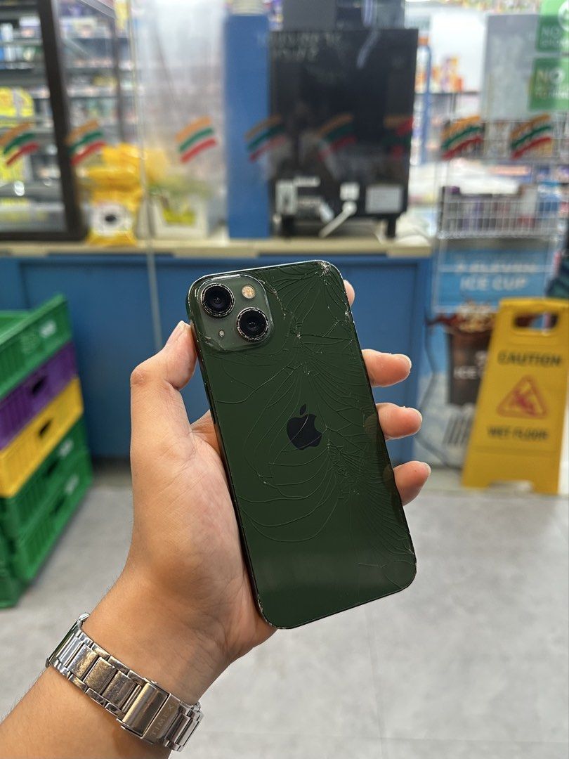 iPhone 13 (Category: iPhone 13 Series) located in Manila. Submitted by Drewy (Listing ID 1468922497, Image 1). Description: For Sale 11k or Swap iPhone 13 ( Green ) 128GB, Any Sim 100BH, IOS 26.6.1 Replaced LCD & Battery, Crack Back Glass & Dents/ Paint Chips Working Face ID & True Tone With Case Only.