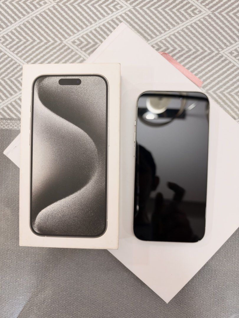 Iphone 15 pro 256gb (Category: iPhone 15 Series) located in Manila. Submitted by happylvoe (Listing ID 1468894454, Image 2). Description: Iphone 15 pro , white titanium , 256gb Inclusions: original box but no cable already . 1 original used spigen case, 1 original hoco case Open line, 81% batt health Faint hairline near front camera but barely noticeable and does not affect front camera. (Test all you want) .