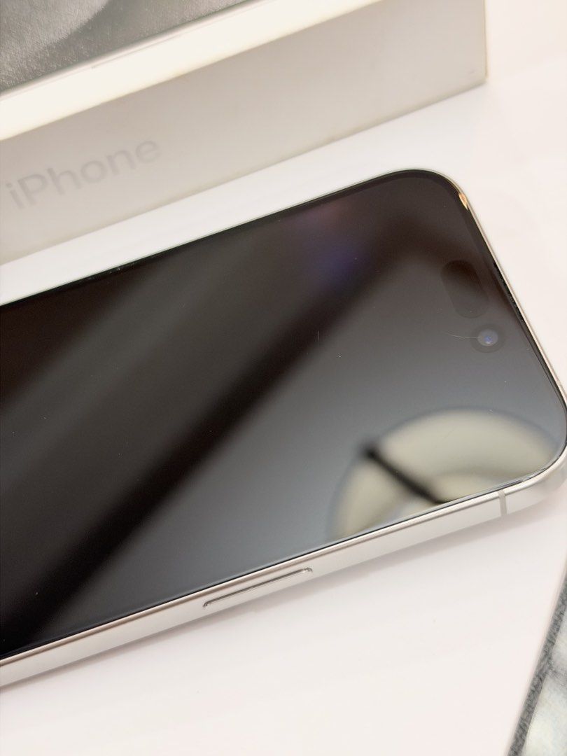 Iphone 15 pro 256gb (Category: iPhone 15 Series) located in Manila. Submitted by happylvoe (Listing ID 1468894454, Image 3). Description: Iphone 15 pro , white titanium , 256gb Inclusions: original box but no cable already . 1 original used spigen case, 1 original hoco case Open line, 81% batt health Faint hairline near front camera but barely noticeable and does not affect front camera. (Test all you want) .