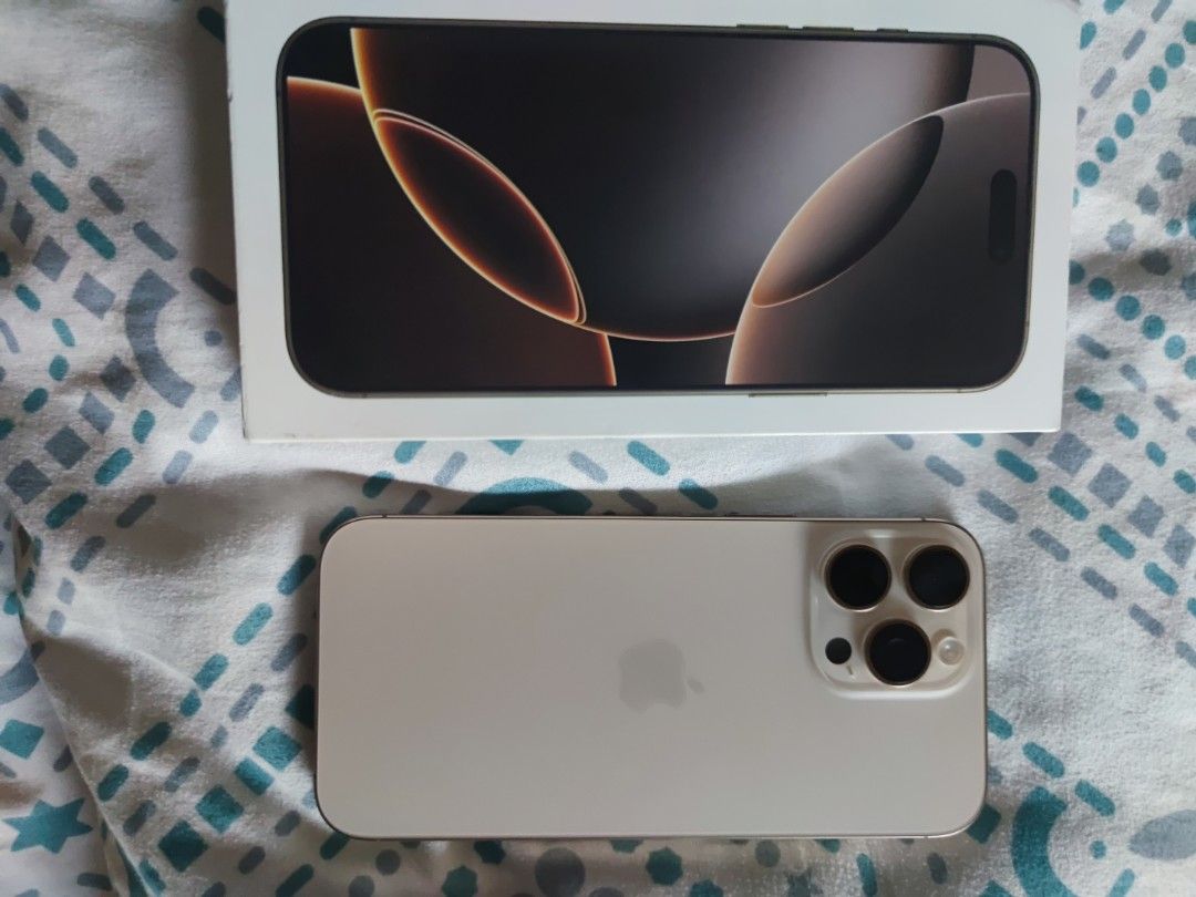 iPhone 16 Pro Max 1TB Desert Titanium (Category: iPhone 16 Series) located in Quezon City. Submitted by flarken (Listing ID 1468858276, Image 1). Description: - Model: iPhone 16 Pro Max - No Sim Tray E-Sim only Factory unlock - Storage: 1TB - Color: Desert Titanium - Condition: Like new / Excellent, comes with original box - Meetup Location: Ever Gotesco, Commonwealth Ave, Quezon City.