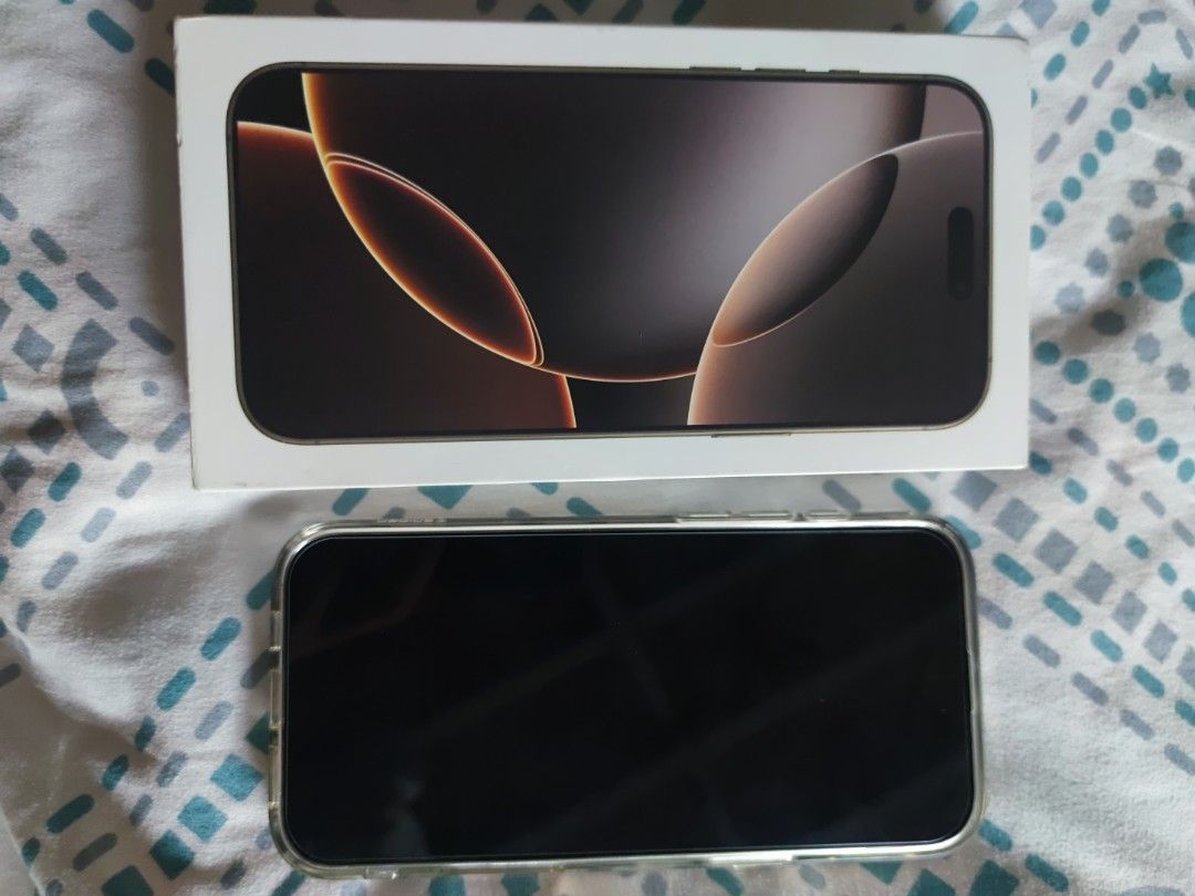iPhone 16 Pro Max 1TB Desert Titanium (Category: iPhone 16 Series) located in Quezon City. Submitted by flarken (Listing ID 1468858276, Image 2). Description: - Model: iPhone 16 Pro Max - No Sim Tray E-Sim only Factory unlock - Storage: 1TB - Color: Desert Titanium - Condition: Like new / Excellent, comes with original box - Meetup Location: Ever Gotesco, Commonwealth Ave, Quezon City.