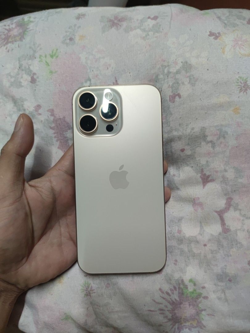 iPhone 16 Pro Max 1TB Desert Titanium (Category: iPhone 16 Series) located in Quezon City. Submitted by flarken (Listing ID 1468858276, Image 3). Description: - Model: iPhone 16 Pro Max - No Sim Tray E-Sim only Factory unlock - Storage: 1TB - Color: Desert Titanium - Condition: Like new / Excellent, comes with original box - Meetup Location: Ever Gotesco, Commonwealth Ave, Quezon City.