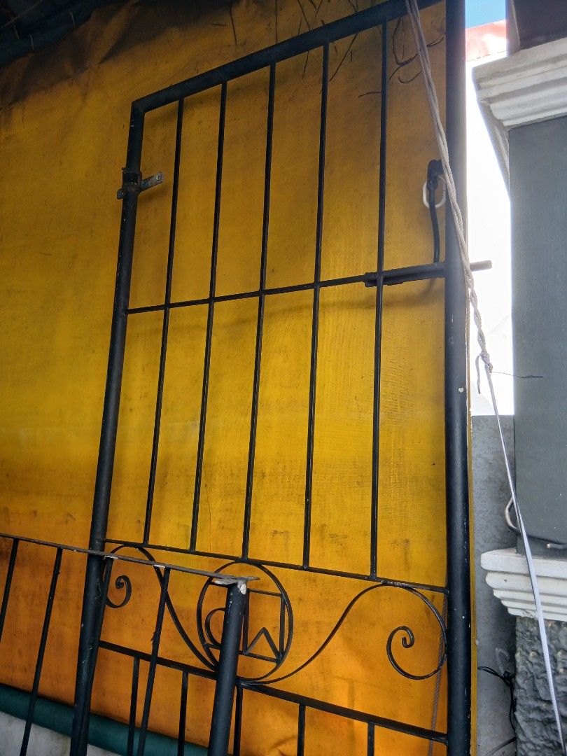 Iron grills and door (Category: Bed Frames & Mattresses) located in Dasmarinas. Submitted by tataysgarage (Listing ID 1468849522, Image 1). Description: 1. Iron grills 4ft ht x 10ft length, 6 in distance per bar.. 2. Iron Door 8ftx 2.5ft, comole hinges used as double security door, grills in pharmacy business, no rust.