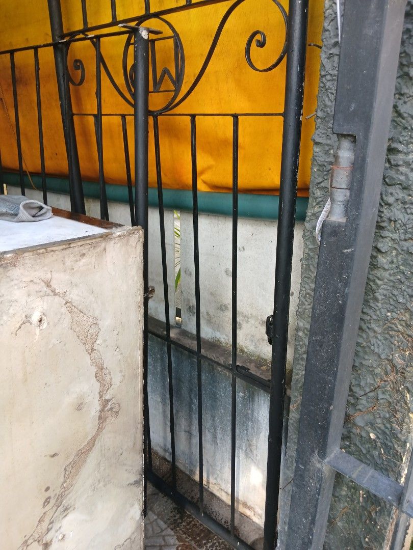 Iron grills and door (Category: Bed Frames & Mattresses) located in Dasmarinas. Submitted by tataysgarage (Listing ID 1468849522, Image 2). Description: 1. Iron grills 4ft ht x 10ft length, 6 in distance per bar.. 2. Iron Door 8ftx 2.5ft, comole hinges used as double security door, grills in pharmacy business, no rust.