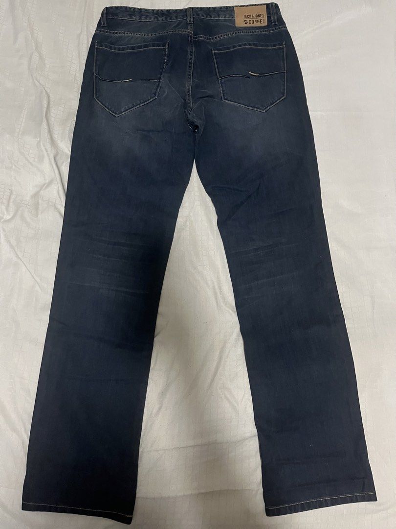 Jack & Jones Core Dark Blue Jeans (Category: Jeans) located in Manila. Submitted by chococoffeeboy (Listing ID 1468848212, Image 3). Description: Jack & Jones Core - Dark blue wash - Closure: Button fly with branded buttons - Details: Distressed accents on front pockets and legs - Branding: Leather logo patch on back waistband - Style: Classic five-pocket design with contrast stitching Waist: 33” Length: 41.5” Hem: 8” Wash before use Payment: Gca