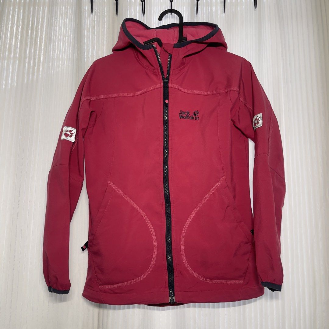 Jack Wolfskin Flexshield Pink Softshell Jacket With Hood (Category: Coats, Jackets and Outerwear) located in Cebu City. Submitted by capybara.97 (Listing ID 1468779083, Image 1). Description: - Brand: Jack Wolfskin - Style: Flexshield outdoor jacket with full zip and attached hood - Color: Dark Pink - Size: can fit XS - Small - Interior: Soft, cozy fleece lining - Pockets: Two lower side pockets - Details: Branded logo embroidery on the chest and