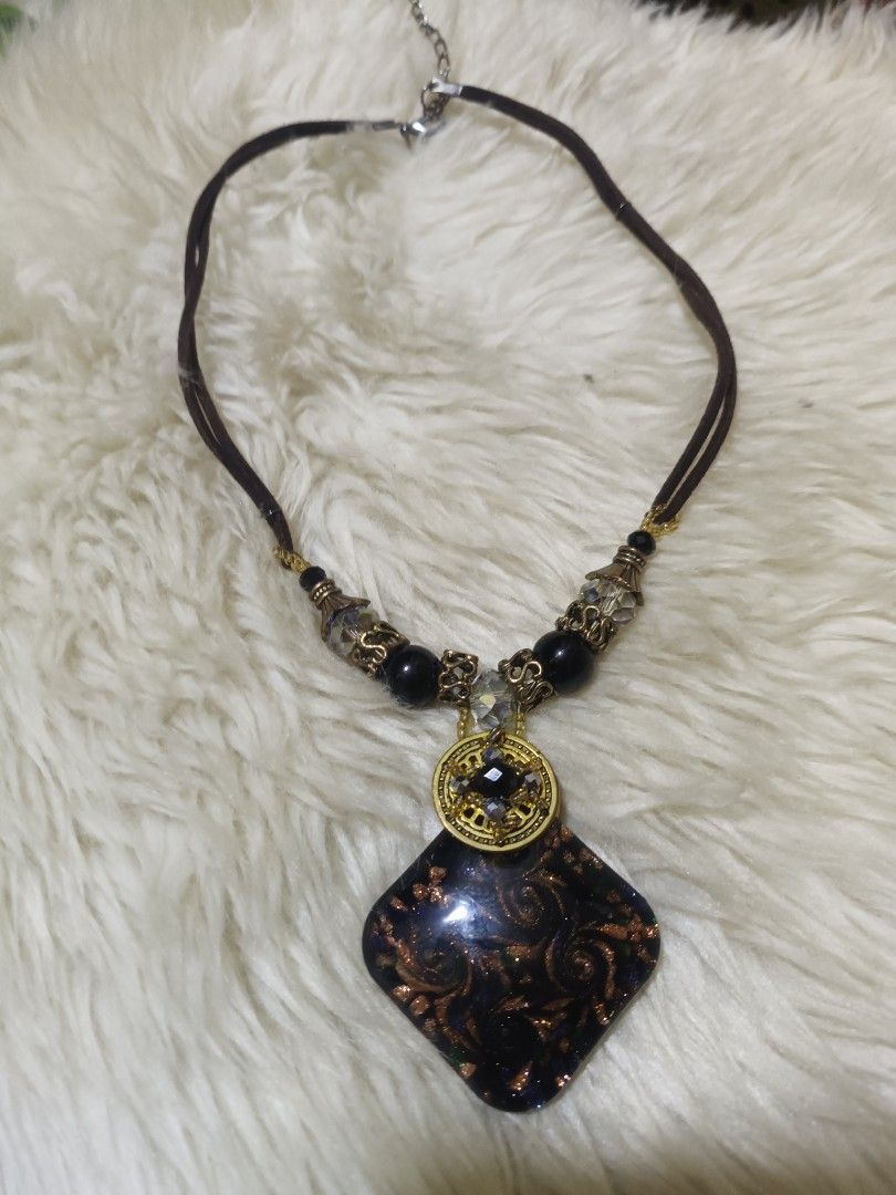 Japan accessories Bundled (Category: Necklaces) located in Cebu City. Submitted by elen30abalo (Listing ID 1468759747, Image 2). Description: - Set of 4 distinct necklaces for endless styling options - Styles range from bohemian to chic and geometric - Includes a black & white woven ribbon chain - Features a brown suede piece with feathers and tassels - Comes with a geometric black & copper pendant on cords - Complete with a long pearl chain acce