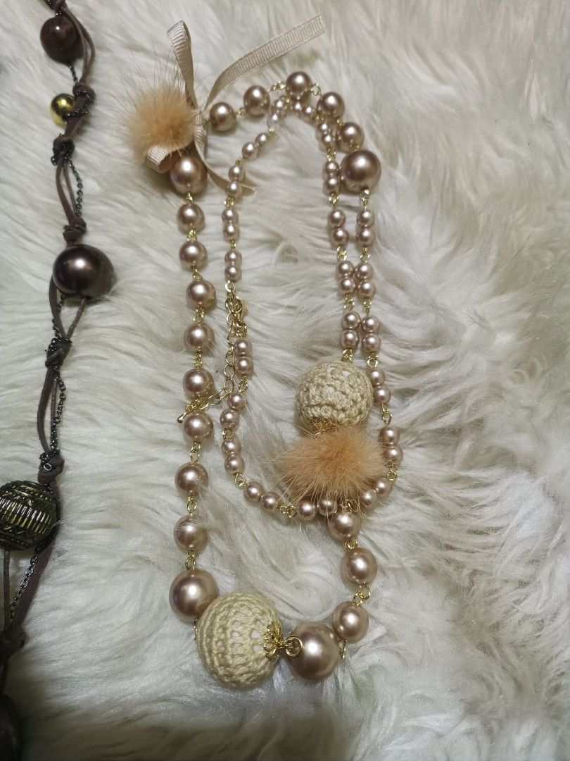 Japan accessories Bundled (Category: Necklaces) located in Cebu City. Submitted by elen30abalo (Listing ID 1468759747, Image 3). Description: - Set of 4 distinct necklaces for endless styling options - Styles range from bohemian to chic and geometric - Includes a black & white woven ribbon chain - Features a brown suede piece with feathers and tassels - Comes with a geometric black & copper pendant on cords - Complete with a long pearl chain acce