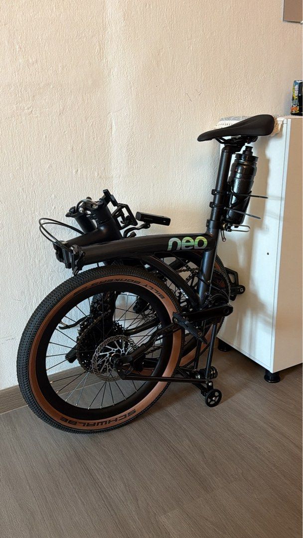 Java Neo 3 (Category: Bicycles) located in Singapore. Submitted by uchiha_monster (Listing ID 1468748190, Image 3). Description: - Model: Black Neo folding bike with carbon fork - Tires: Schwalbe Billy Bonkers - Accessories: Black water bottle holder on seat post and a small front pouch - Storage: Compact fold, easy to store and carry.