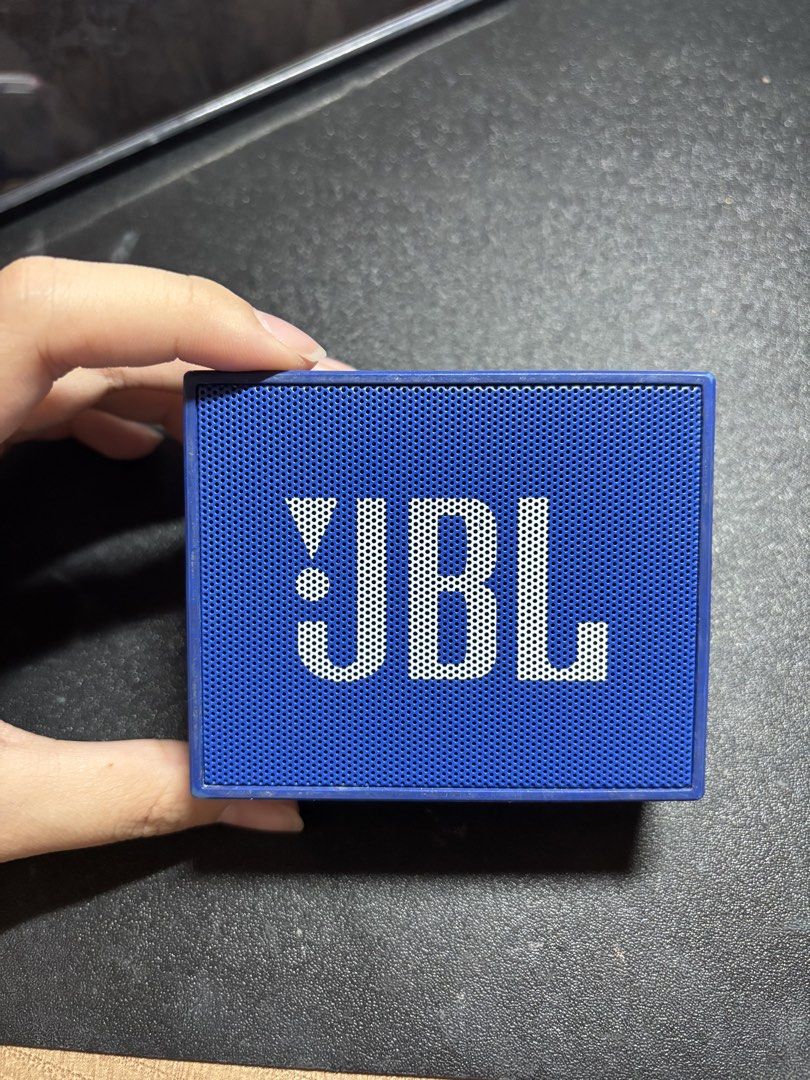 JBL GO Speaker Blue (Category: Soundbars, Speakers & Amplifiers) located in Quezon City. Submitted by skie_ (Listing ID 1468875140, Image 1). Description: - Authentic JBL GO portable Bluetooth speaker in vibrant blue - Compact square design featuring a durable rubberized body and metal front grille - Convenient top controls for power, Bluetooth pairing, volume, and calls - Equipped with micro-USB charging and audio input ports - Features a cute d
