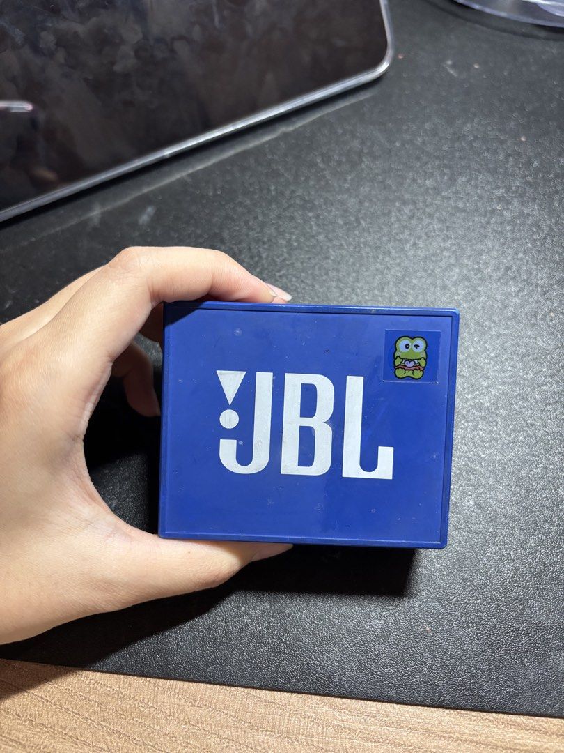 JBL GO Speaker Blue (Category: Soundbars, Speakers & Amplifiers) located in Quezon City. Submitted by skie_ (Listing ID 1468875140, Image 2). Description: - Authentic JBL GO portable Bluetooth speaker in vibrant blue - Compact square design featuring a durable rubberized body and metal front grille - Convenient top controls for power, Bluetooth pairing, volume, and calls - Equipped with micro-USB charging and audio input ports - Features a cute d