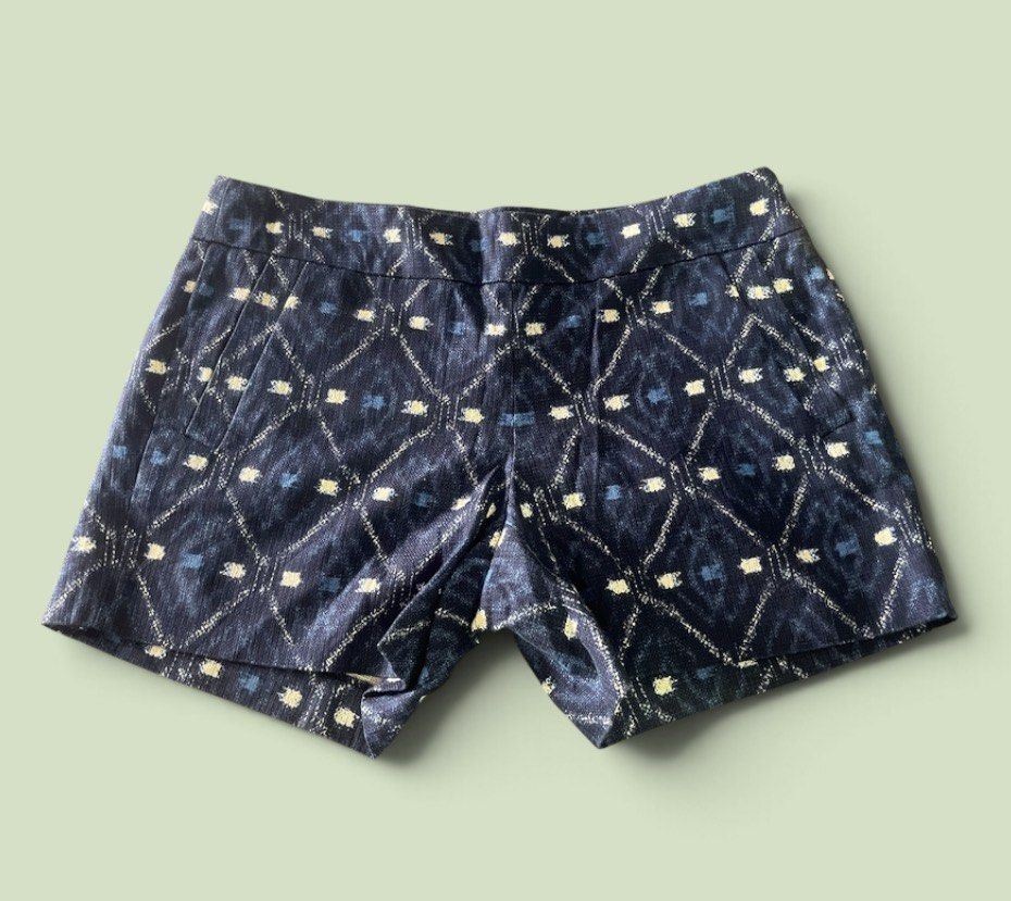 j.crew Printed Pattern Shorts (Category: Shorts) located in San Pedro. Submitted by lifebeginsaftercoff33 (Listing ID 1468745444, Image 2). Description: - Brand: J.Crew - Color: Navy blue with geometric diamond ikat print and white/blue dashes - Material: 100% cotton with smooth inner lining - Fit: Mid-rise waist with zip fly and hook-and-eye closure - Pockets: Functional front pockets and secure button-flap back pockets - Condition: Excellent, c