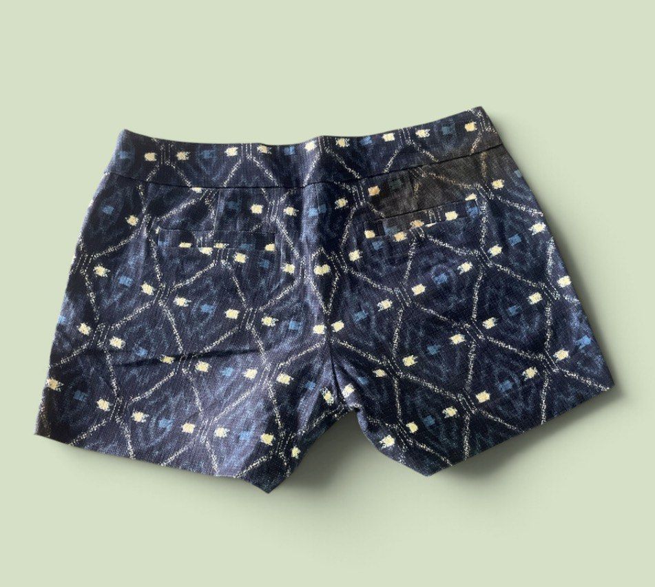 j.crew Printed Pattern Shorts (Category: Shorts) located in San Pedro. Submitted by lifebeginsaftercoff33 (Listing ID 1468745444, Image 3). Description: - Brand: J.Crew - Color: Navy blue with geometric diamond ikat print and white/blue dashes - Material: 100% cotton with smooth inner lining - Fit: Mid-rise waist with zip fly and hook-and-eye closure - Pockets: Functional front pockets and secure button-flap back pockets - Condition: Excellent, c