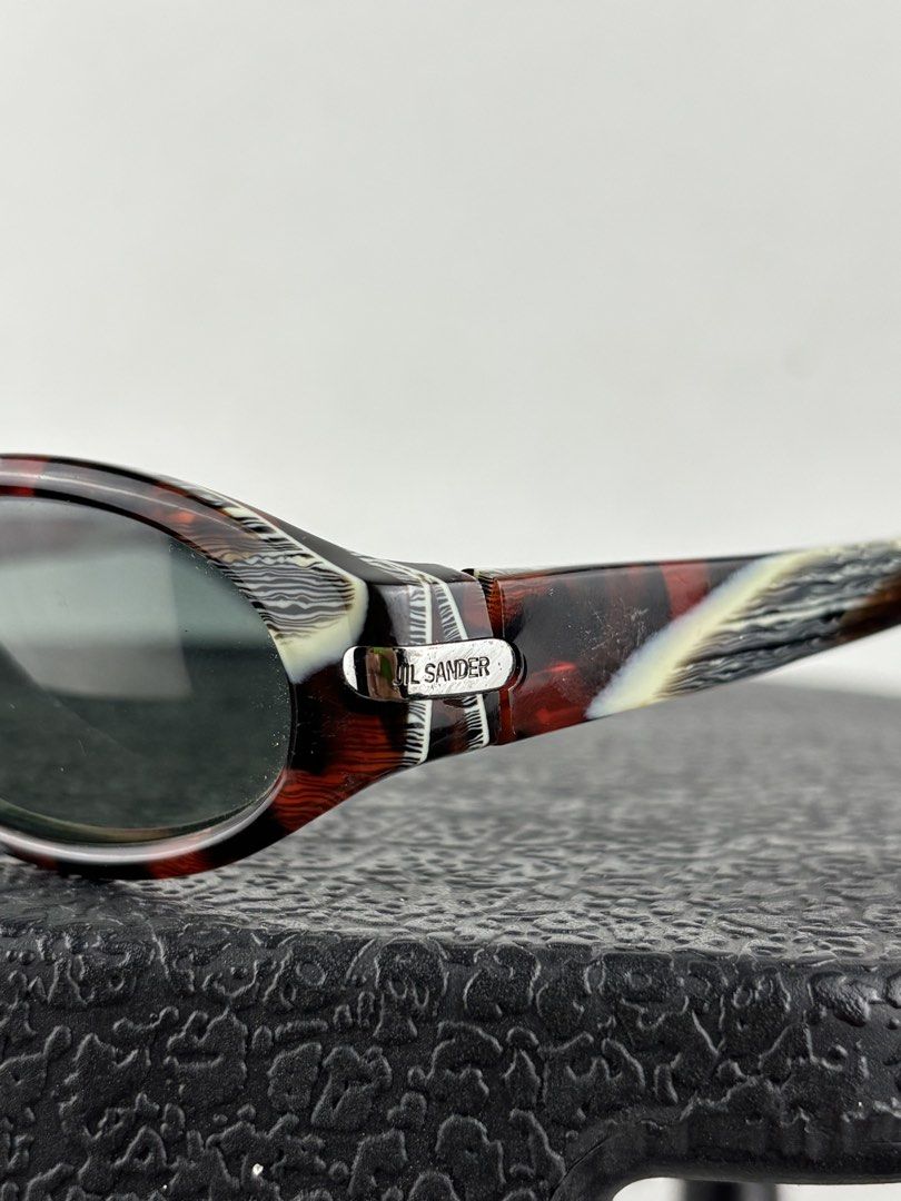 Jil Sander Marble Effect Sunglasses (Category: Sunglasses & Eyewear) located in Makati City. Submitted by ragrepository (Listing ID 1468786620, Image 2). Description: Jil Sander Glasses only, no inclusions Condition- 9/10 Flaw- Minimal wear .