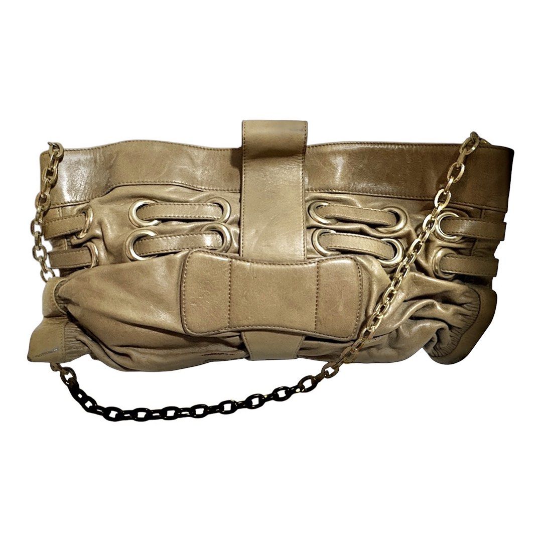 Jimmy Choo Taupe Leather Shoulder Bag (Category: Luxury Bags & Wallets) located in Los Banos. Submitted by amadea_c (Listing ID 1468752821, Image 2). Description: - Brand: Jimmy Choo - Material: Premium taupe leather - Hardware: Gold-tone with engraved logo plate - Closure: Center buckle strap - Strap: Black and gold-tone chain link - Interior: Fabric-lined with zippered pocket and brand plaque - Design: Spacious, slouchy everyday shoulder bag FO