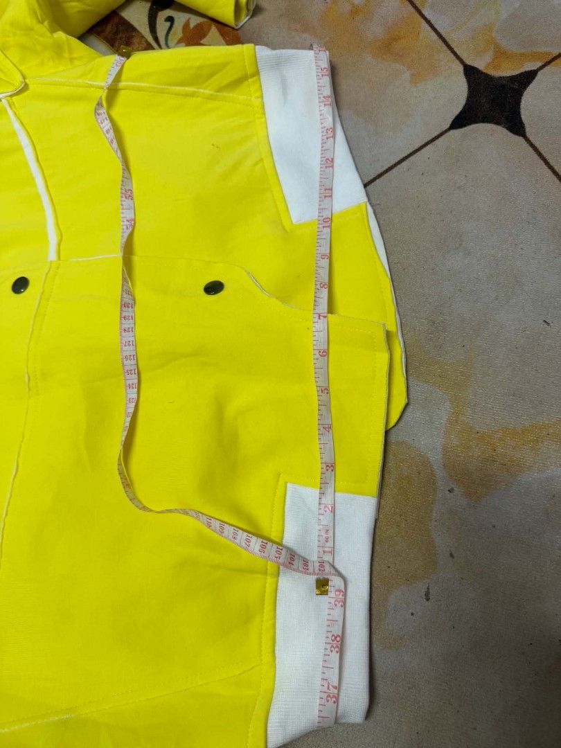 Jiumei Yellow White Bomber Jacket Size XL (Category: Coats, Jackets and Outerwear) located in Caloocan City. Submitted by mylove326 (Listing ID 1468803294, Image 2). Description: - Brand: Jiumei - Size: XL (Laid-flat length: approx. 23 inches) - Color: Bright yellow with white ribbed collar, cuffs, and hem - Design: Unique asymmetric button front closure and shoulder epaulets - Condition: Great piece to make a statement outfit pop.