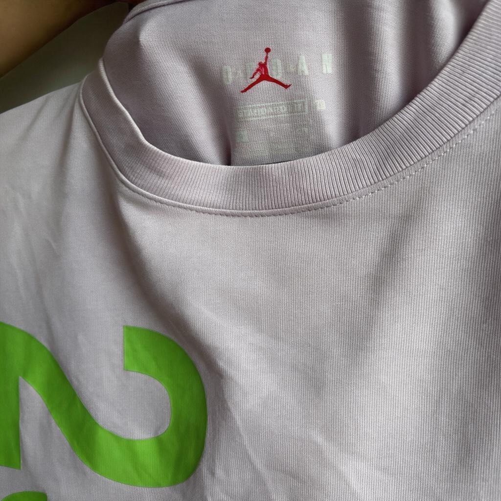 Jordan 23 Engineered T-shirt Lilac (Category: Tshirts & Polo Shirts ) located in Iloilo. Submitted by oddforest.c9c7d5 (Listing ID 1468776223, Image 3). Description: - Brand: Jordan 23 Engineered - Condition: Like new with tags attached (Deadstock) - Color: Light purple / Lilac - Size: Large 19x27 - Material: 100% premium cotton - Fit: Relaxed fit with standard crew neckline - Design details: Large green '23 ENGINEERED' front graphic, small Jumpm