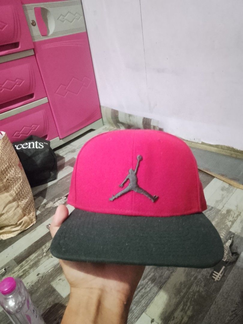 Jordan Jumpman Snapback Cap Red Black (Category: Caps & Hats) located in Quezon City. Submitted by theoneshop1 (Listing ID 1468892305, Image 1). Description: - Color: Red crown with a black flat brim - Branding: Embroidered Jumpman logo on the front and Jordan text on the snap - Fit: Adjustable plastic snap closure at the back - Details: Interior taped seams featuring 'Quality Inspired by the Greatest Player Ever' text - Material: 100% polyester 