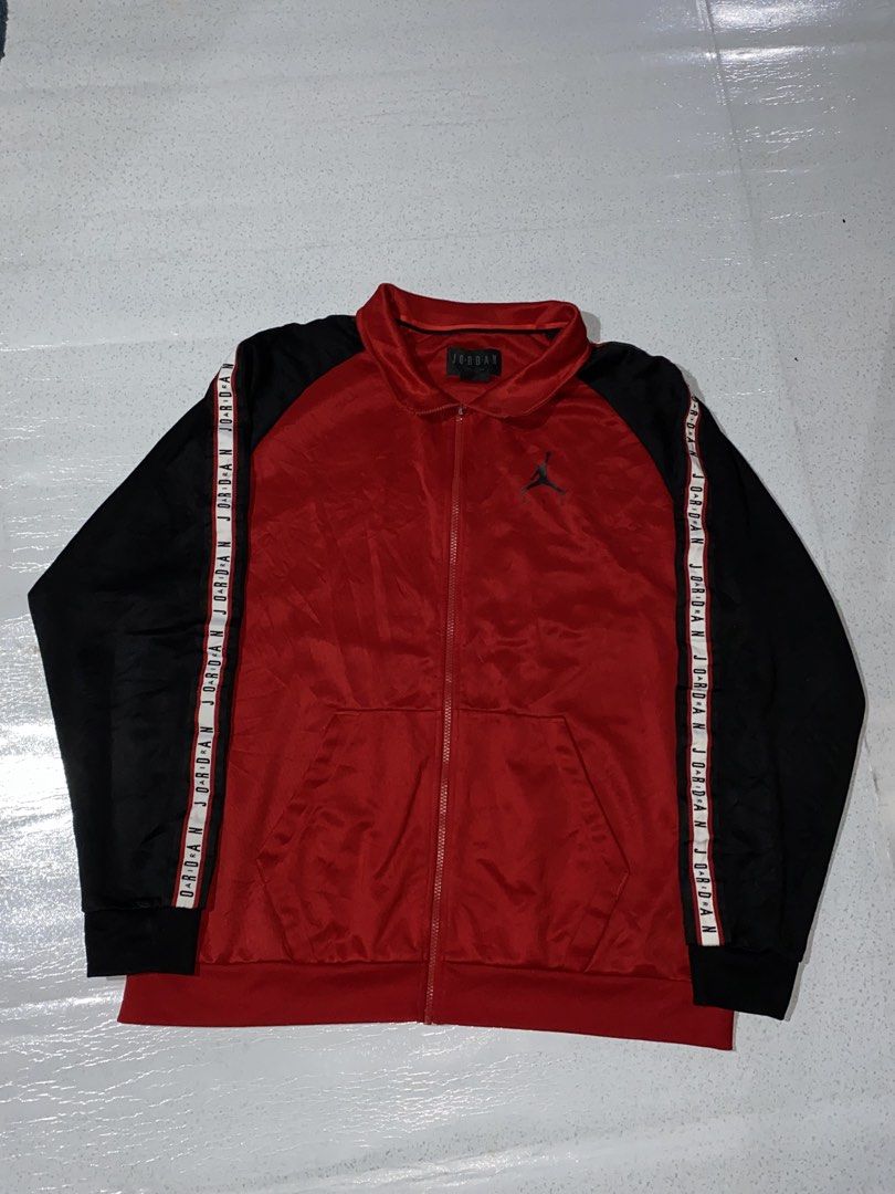 Jordan Red Black Track Jacket Size XL (Category: Coats, Jackets and Outerwear) located in Manila. Submitted by jeproxthrift (Listing ID 1468893241, Image 1). Description: - Brand: Jordan - Color: Red and black with white branding - Size: XL - Material: 100% polyester - Features: Zip-up front, side pockets, branded sleeve taping, and chest Jumpman logo - Origin: Made in Vietnam - Condition: Classic retro style, ready to wear.