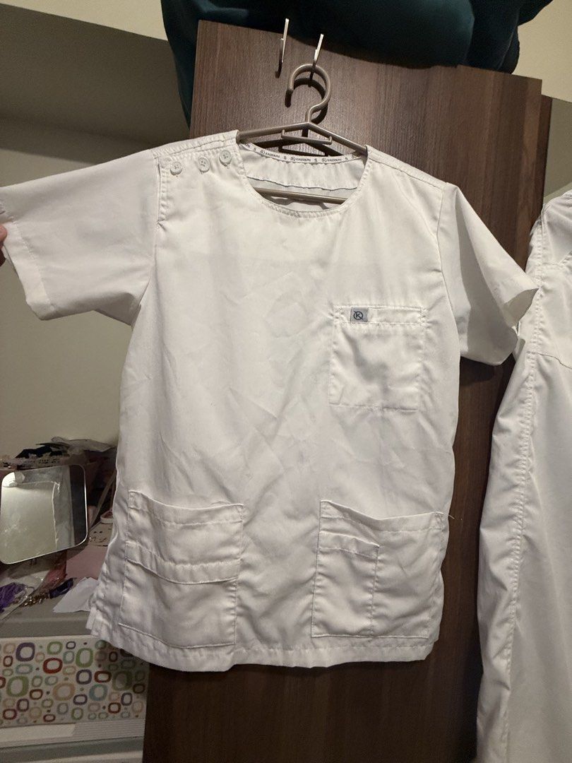 Kaizen PH White Scrub Suit Set - SMALL (Category: Sets or Coordinates) located in Quezon City. Submitted by joroguhi (Listing ID 1468804370, Image 2). Description: selling my preloved kaizen white scrub set - used for a training size SMALL color ALL WHITE bought for around 1.1k sa kaizenph website mismo blouse - round neck, with button design, with front pockets; 9/10 pants - with 2 front pockets, with 2 back pockets; garterized with strings; ‼️W