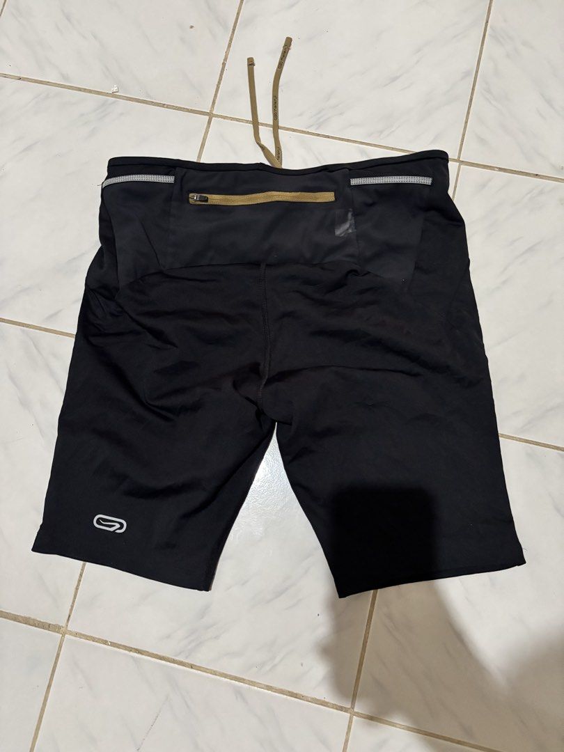Kalenji Black Running Shorts with Drawstring (Category: Activewear) located in Kalibo. Submitted by mack29 (Listing ID 1468726740, Image 2). Description: - Brand: Kalenji - Color: Classic Black - Condition: Brand new with tags attached - Pocket: Built-in zipper pocket at the back waistband for keys or cards - Fit: Adjustable drawstring waist with branded aglets - Safety: Reflective accents for safe night running - Fabric: Lightweight, breathable,