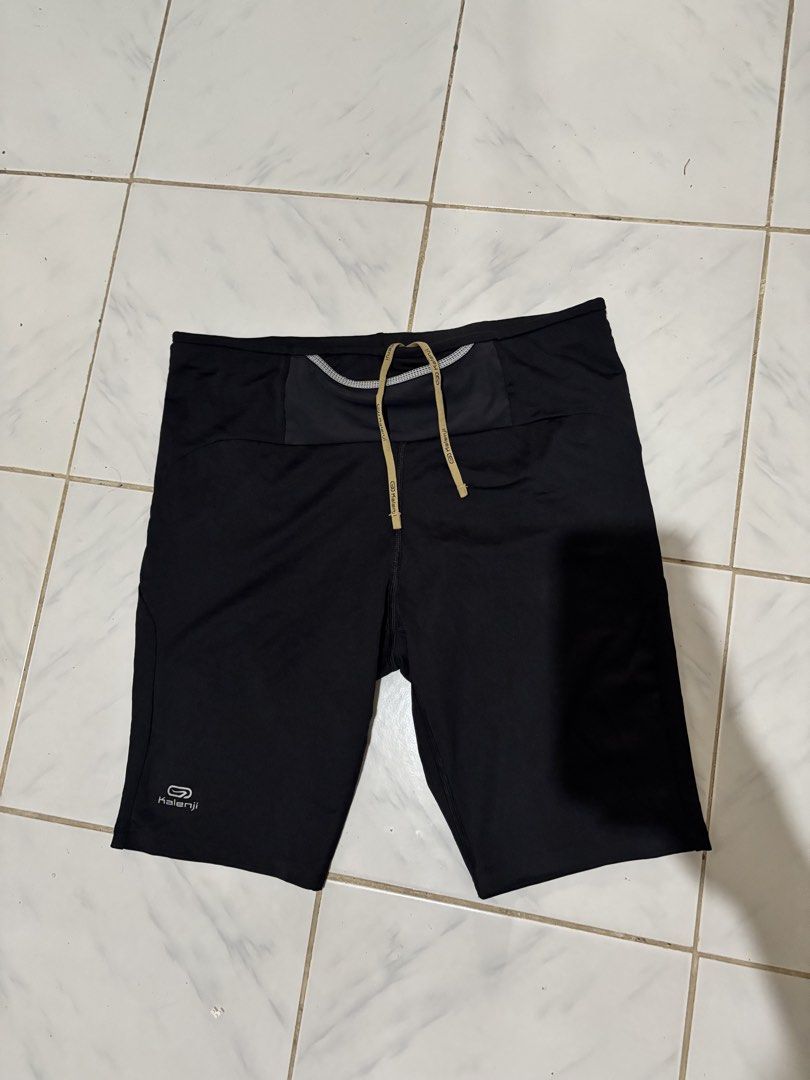 Kalenji Black Running Shorts with Drawstring (Category: Activewear) located in Kalibo. Submitted by mack29 (Listing ID 1468726740, Image 3). Description: - Brand: Kalenji - Color: Classic Black - Condition: Brand new with tags attached - Pocket: Built-in zipper pocket at the back waistband for keys or cards - Fit: Adjustable drawstring waist with branded aglets - Safety: Reflective accents for safe night running - Fabric: Lightweight, breathable,