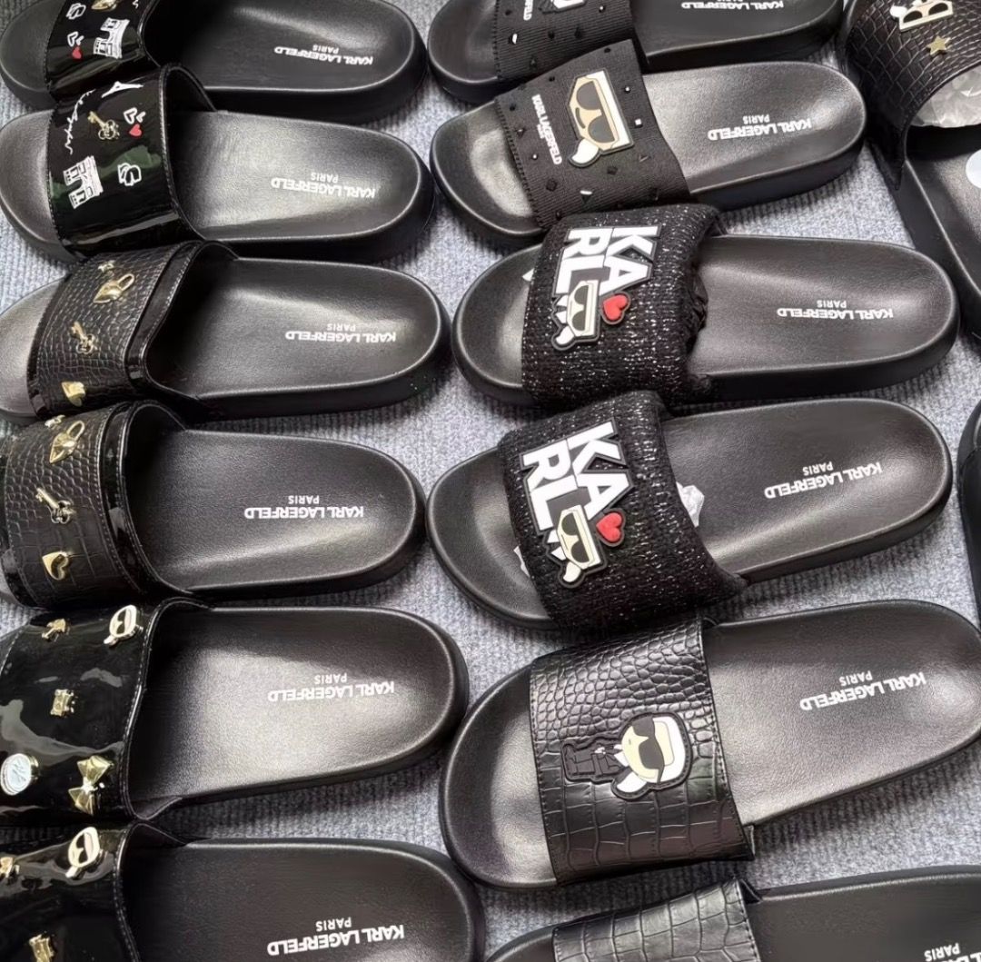Karl Lagerfeld Paris Black Slides Sandals (Category: Flats & Sandals) located in Pasay City. Submitted by kgemsluxuryboutique (Listing ID 1468718681, Image 1). Description: - 100% Authentic Karl Lagerfeld Paris slides - Multiple stylish designs available: textured fabric, metallic accents, & classic logo prints - Super comfortable contoured footbed for all-day wear - Textured outsole provides reliable grip and anti-slip traction - Easy slip-on st