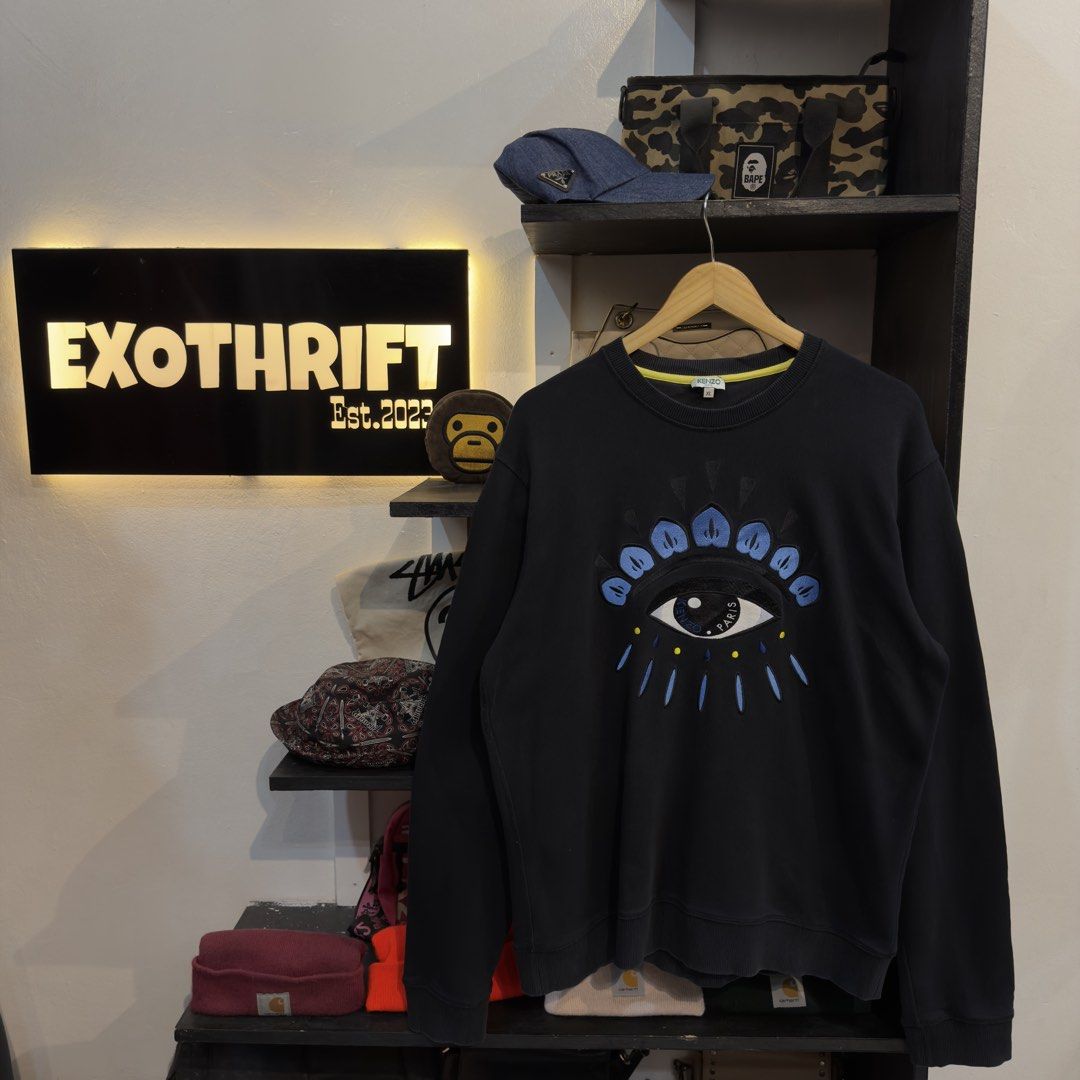Kenzo Eye Embroidered Logo Sweatshirt (Category: Coats, Jackets and Outerwear) located in Manila. Submitted by jerichomal82553 (Listing ID 1468911030, Image 1). Description: Kenzo Eye Embroidered Logo Sweatshirt 23.5 by 28 Good Condition Complete Tags .