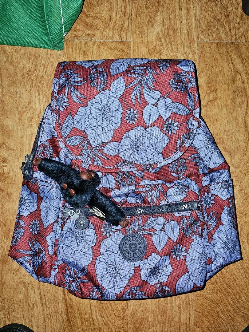 Kipling Ezra S Backpack Gothic Rose Floral (Category: Backpacks) located in Quezon City. Submitted by findsbydavie (Listing ID 1468821965, Image 1). Description: COMES WITH ORIGINAL PLASTIC BAG Negotiable price - Brand: Kipling Ezra S Backpack - Color/Pattern: Gothic Rose (Red fabric with blue flowers and leaves) - Condition: Brand new with original store tag ($119 value) - Style Number: KI2420 - Features: Dark adjustable straps and signature fur
