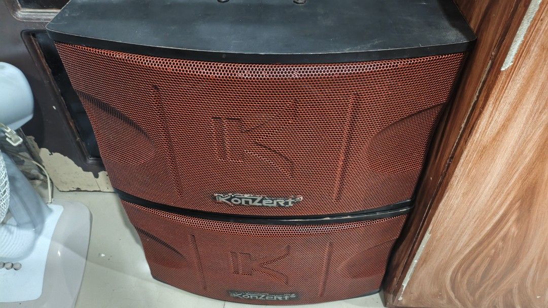 Konzert KS-450V Karaoke Speaker System (Category: Soundbars, Speakers & Amplifiers) located in Caloocan City. Submitted by pinongai (Listing ID 1468743229, Image 1). Description: Konzert KS-450V karaoke speakers. Red mesh metal front grilles with black cabinets. 2-way 3 speaker bass reflex design. Maximum power 450 watts at 8 ohms impedance. Spring clip terminal connections on the back. Solid build, heavy duty for home audio setups. Some dust and