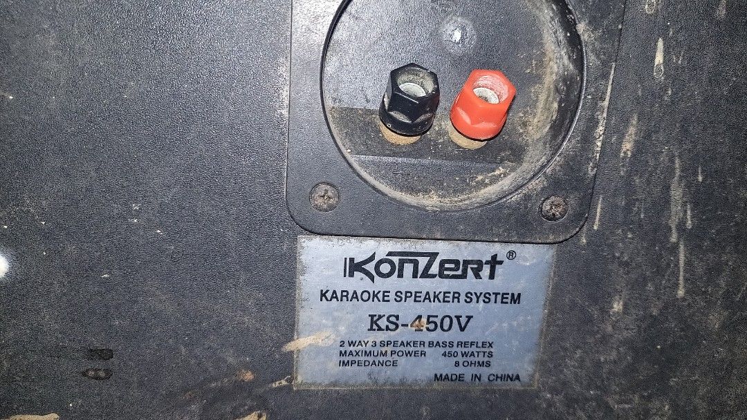 Konzert KS-450V Karaoke Speaker System (Category: Soundbars, Speakers & Amplifiers) located in Caloocan City. Submitted by pinongai (Listing ID 1468743229, Image 3). Description: Konzert KS-450V karaoke speakers. Red mesh metal front grilles with black cabinets. 2-way 3 speaker bass reflex design. Maximum power 450 watts at 8 ohms impedance. Spring clip terminal connections on the back. Solid build, heavy duty for home audio setups. Some dust and