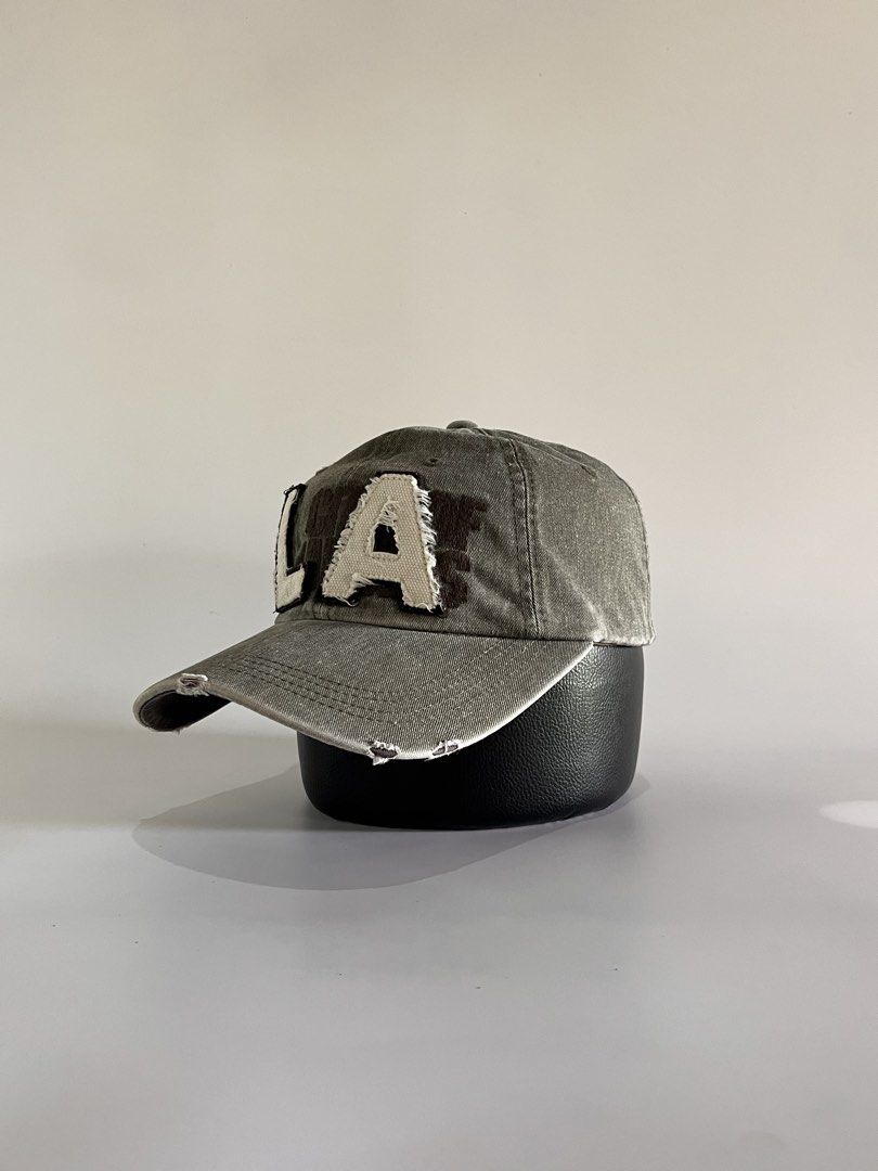 LA Script Y2K Dadhat (Category: Caps & Hats) located in Malaybalay. Submitted by haulsome (Listing ID 1468853472, Image 2). Description: LA Script Y2K Dadhat -No flaws/Like new -In beautiful stone washed -Features big LA script up front and a rugged style -Adult size, adjustable strap 400php, +sf.