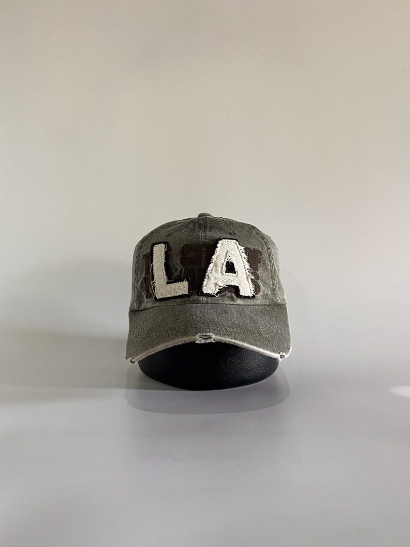LA Script Y2K Dadhat (Category: Caps & Hats) located in Malaybalay. Submitted by haulsome (Listing ID 1468853472, Image 1). Description: LA Script Y2K Dadhat -No flaws/Like new -In beautiful stone washed -Features big LA script up front and a rugged style -Adult size, adjustable strap 400php, +sf.