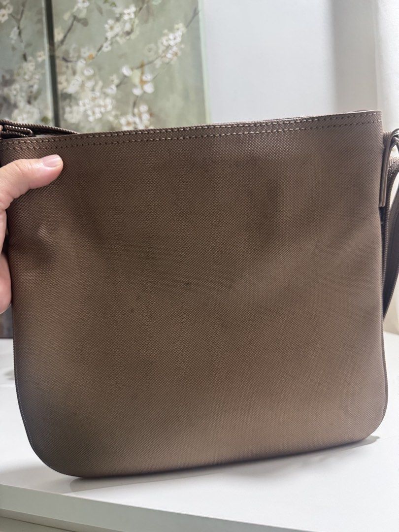 Lacoste Crossbody Bag (Category: Cross-body Bags) located in Manila. Submitted by prelovemd (Listing ID 1468712750, Image 2). Description: Authentic lacoste Bought in US Color bronze-gold Take note of stains inside the bags Barely noticeable minor scratches on external Zippers working well .