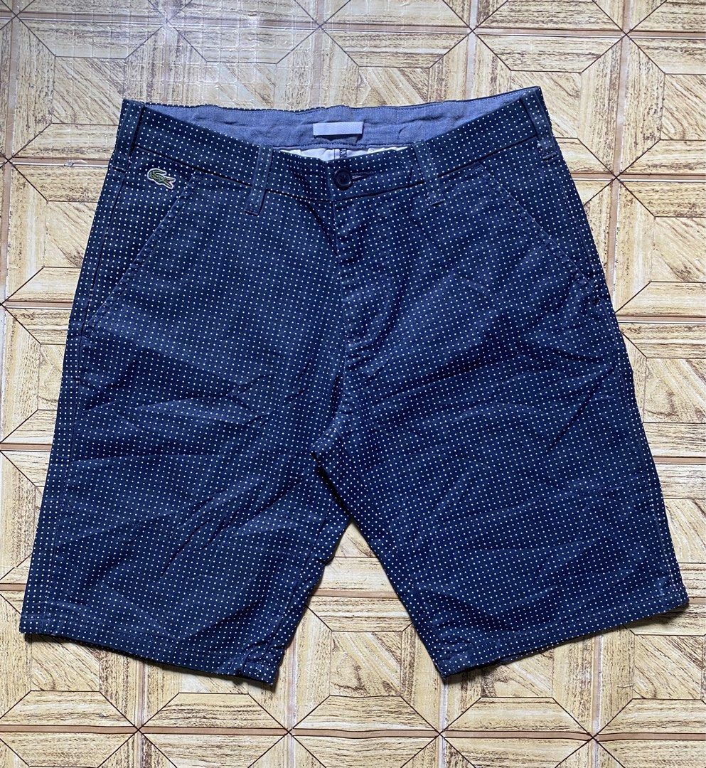 Lacoste Live Polka Dot Short (Category: Shorts) located in Manila. Submitted by tygaangub1096 (Listing ID 1468883392, Image 1). Description: - Brand: Lacoste Live - Size: US 30 / French 38 20 length - Color: Dark blue with white polka dots - Closure: Button with zipper fly - Pockets: Two front slant pockets and two back welt pockets - Details: Small embroidered crocodile logo on the front right and chambray interior trim - Condition: Excellent - 
