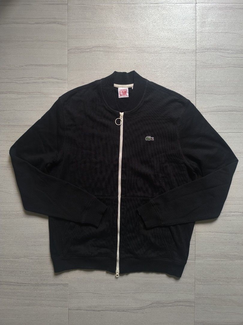 Lacoste L!VE Black Zip-Up Jacket (Category: Coats, Jackets and Outerwear) located in Talisay. Submitted by jppppppppp (Listing ID 1468793274, Image 1). Description: Lacoste Live Varsity Jacket Cotton Tagged as Size 5 /Large Actual Dimensions 22*27 Shoulder 18" Sleeve Length 26.5 Excellent Condition 2️⃣3️⃣9️⃣0️⃣+SF 09472849954.