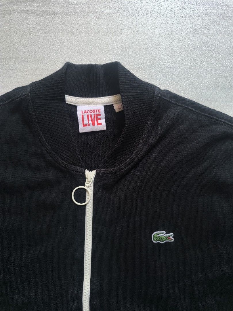 Lacoste L!VE Black Zip-Up Jacket (Category: Coats, Jackets and Outerwear) located in Talisay. Submitted by jppppppppp (Listing ID 1468793274, Image 2). Description: Lacoste Live Varsity Jacket Cotton Tagged as Size 5 /Large Actual Dimensions 22*27 Shoulder 18" Sleeve Length 26.5 Excellent Condition 2️⃣3️⃣9️⃣0️⃣+SF 09472849954.