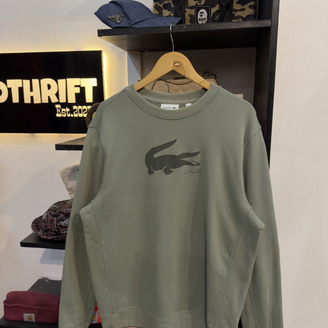 Lacoste Mid Logo Sweatshirt (Category: Coats, Jackets and Outerwear) located in Manila. Submitted by jerichomal82553 (Listing ID 1468911786, Image 2). Description: Lacoste Mid Logo Sweatshirt 24 by 29 Good Condition Complete Tags .