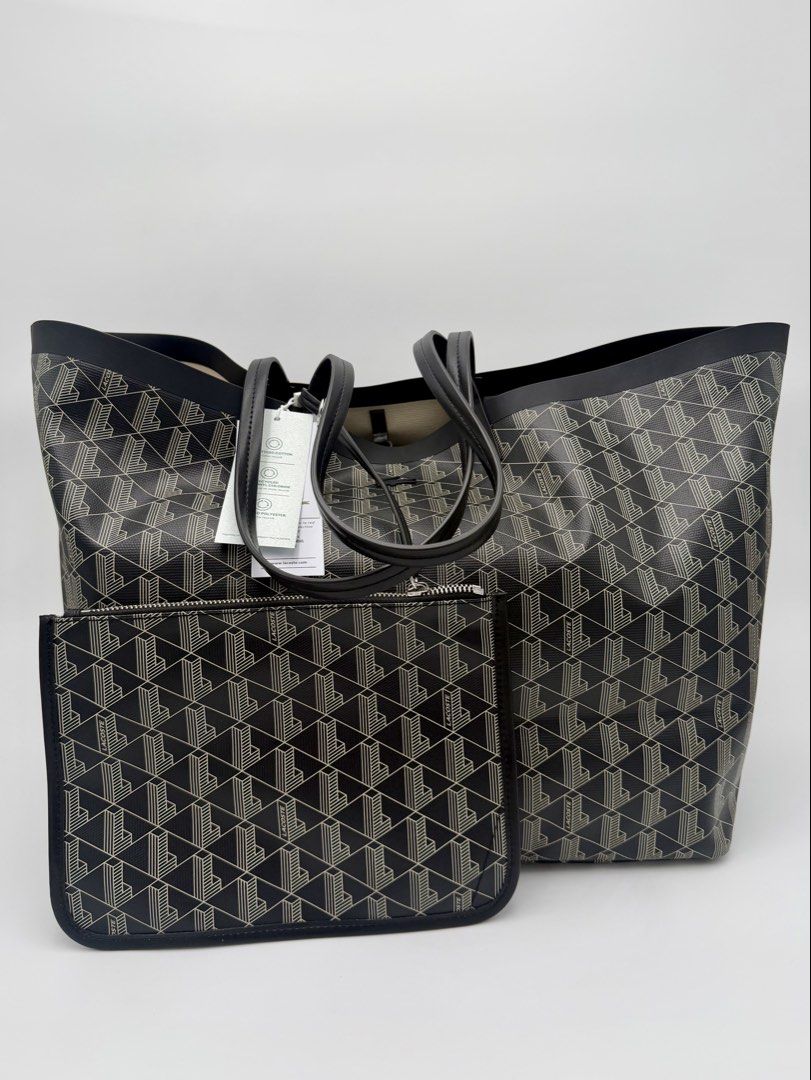 Lacoste Monogram Tote Bag with Pouch (Category: Tote Bags) located in Manila. Submitted by mrjalandoni (Listing ID 1468762051, Image 1). Description: - Brand new Lacoste tote bag with original store tags attached - Chic dark navy and cream all-over monogram pattern - Includes a convenient matching zippered pouch - Designed with comfortable double shoulder handles - Spacious interior perfect for everyday use.