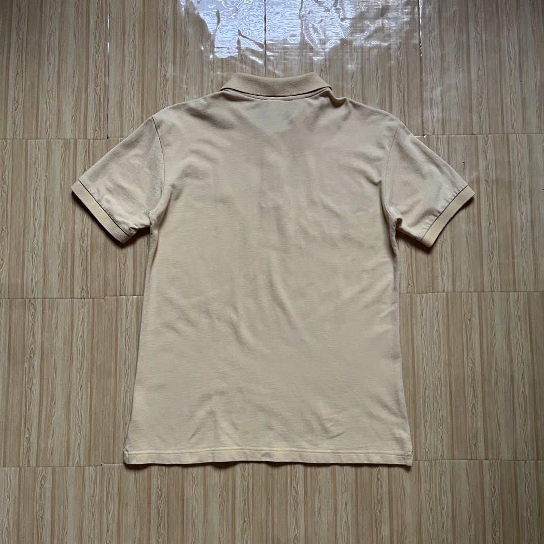 Lacoste Polo Shirt (Category: Tshirts & Polo Shirts ) located in Hagonoy. Submitted by ianthrift_ph (Listing ID 1468797487, Image 2). Description: complete tags size medium 20 width, 27 length good condition color rate 9/10 issue: one tiny hole.
