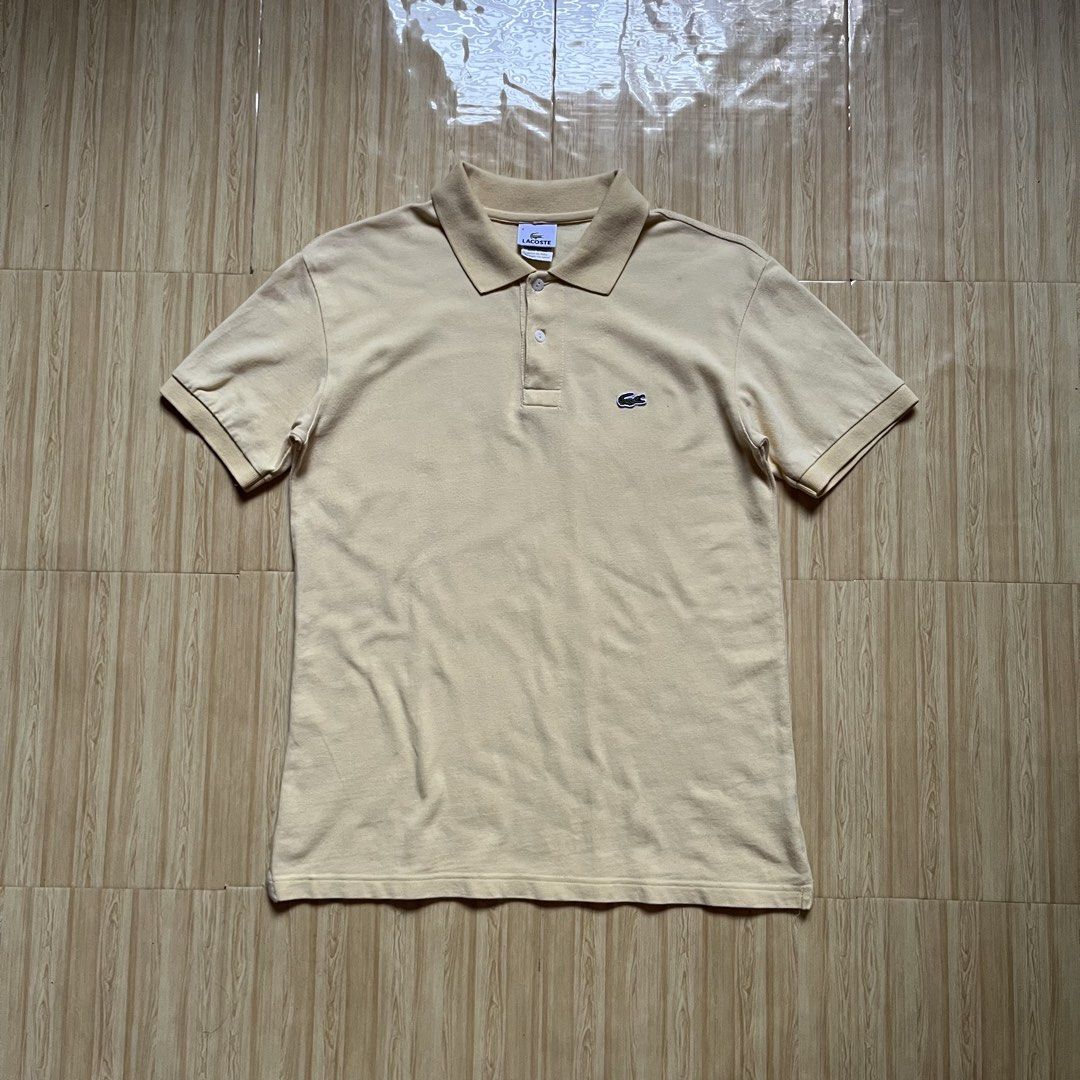 Lacoste Polo Shirt (Category: Tshirts & Polo Shirts ) located in Hagonoy. Submitted by ianthrift_ph (Listing ID 1468797487, Image 1). Description: complete tags size medium 20 width, 27 length good condition color rate 9/10 issue: one tiny hole.