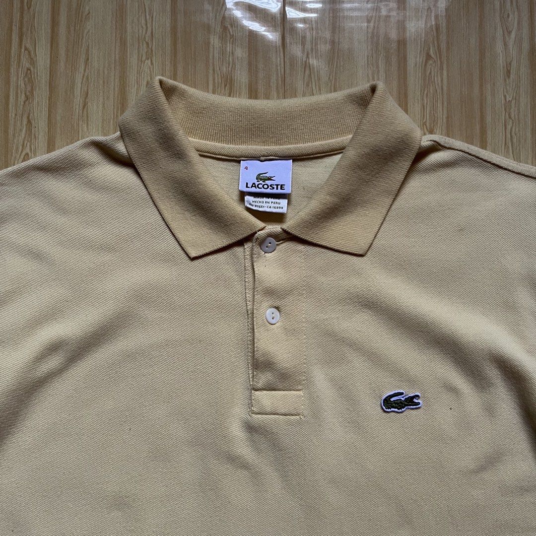 Lacoste Polo Shirt (Category: Tshirts & Polo Shirts ) located in Hagonoy. Submitted by ianthrift_ph (Listing ID 1468797487, Image 3). Description: complete tags size medium 20 width, 27 length good condition color rate 9/10 issue: one tiny hole.