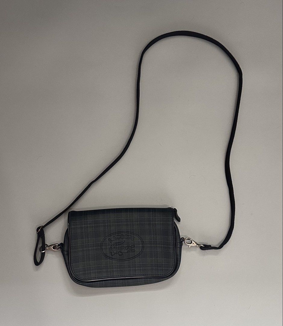 Lacoste Sling Bag (Category: Activewear) located in Manila. Submitted by thriftavenueph (Listing ID 1468725295, Image 2). Description: Fs: Lacoste Sling Bag Condition: excellent, no cracks, no stain, no holes, working all magnet and zippers Price: 3,500.